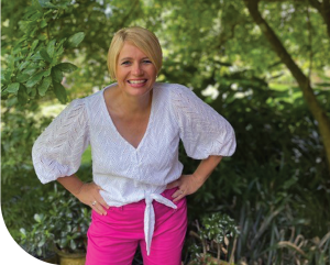 jenny vile standing among trees smiling
